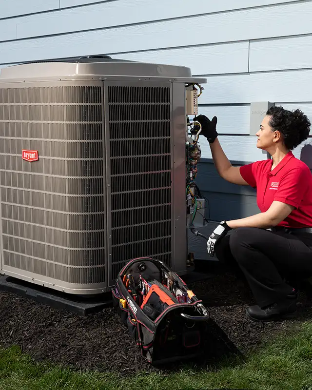 HVAC Technician installing a Bryant® Air Conditioning Unit | White Sands Cooling and Heating